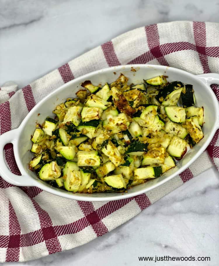 healthy zucchini casserole in dish on a dishtowel 