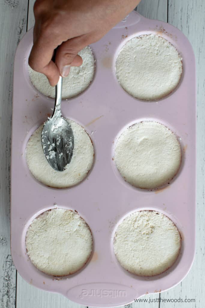 press coconut cup filling into muffin mold