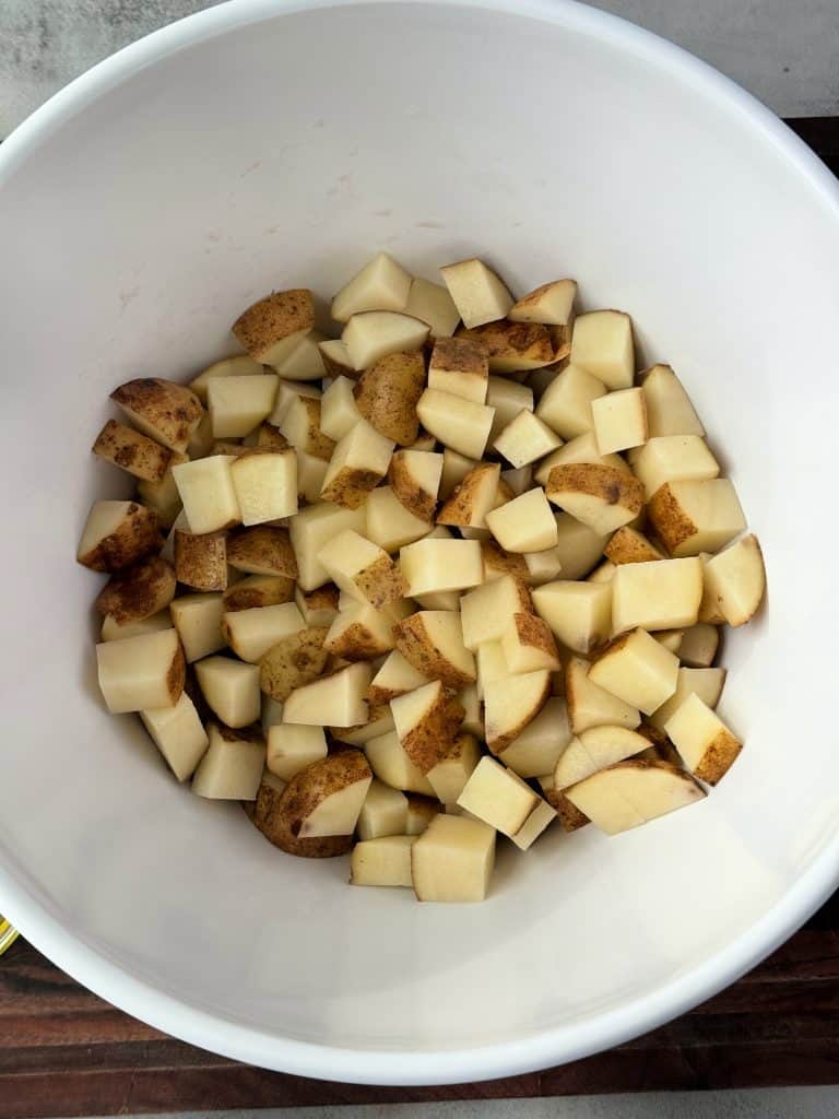 potato cubes in a large bowl 