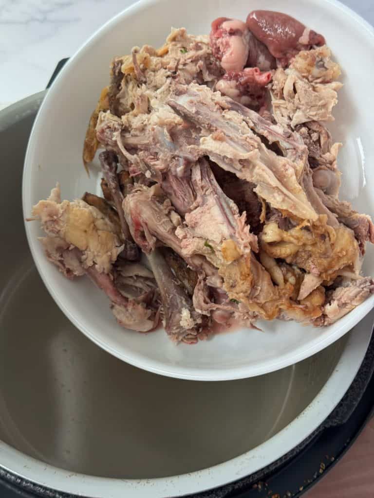 chicken carcass and gizzards in chicken bone broth 