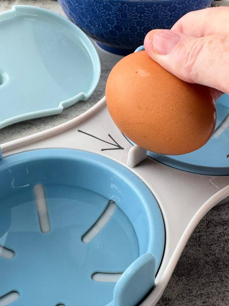 built in egg cracker on plastic poacher