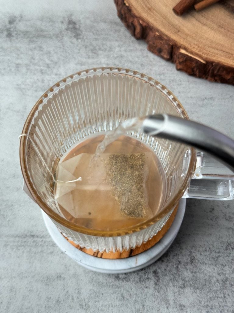 hot water on chamomile tea bag
