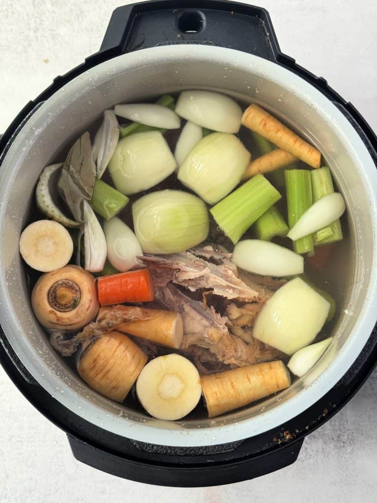 chicken scraps, vegetables and water in ninja foodi pot 