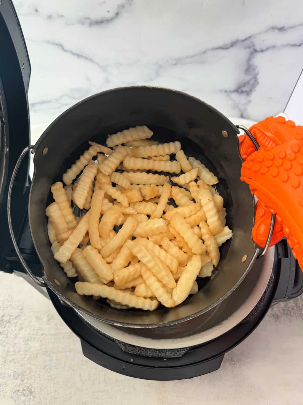toss frozen French fries in air fryer basket