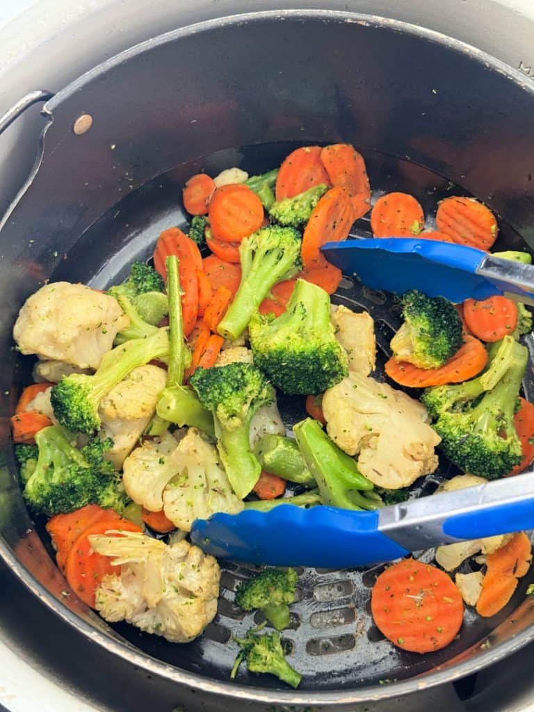 toss frozen vegetables in air fryer basket 