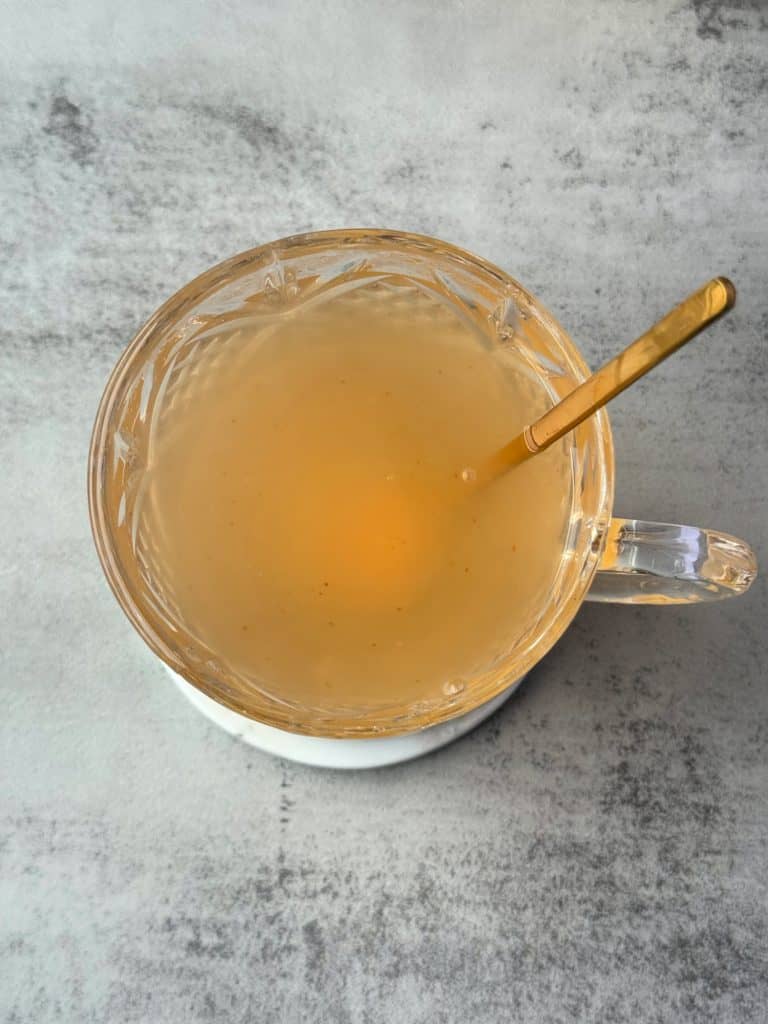 stir Apple Cider Vinegar Honey and Cayenne tea drink