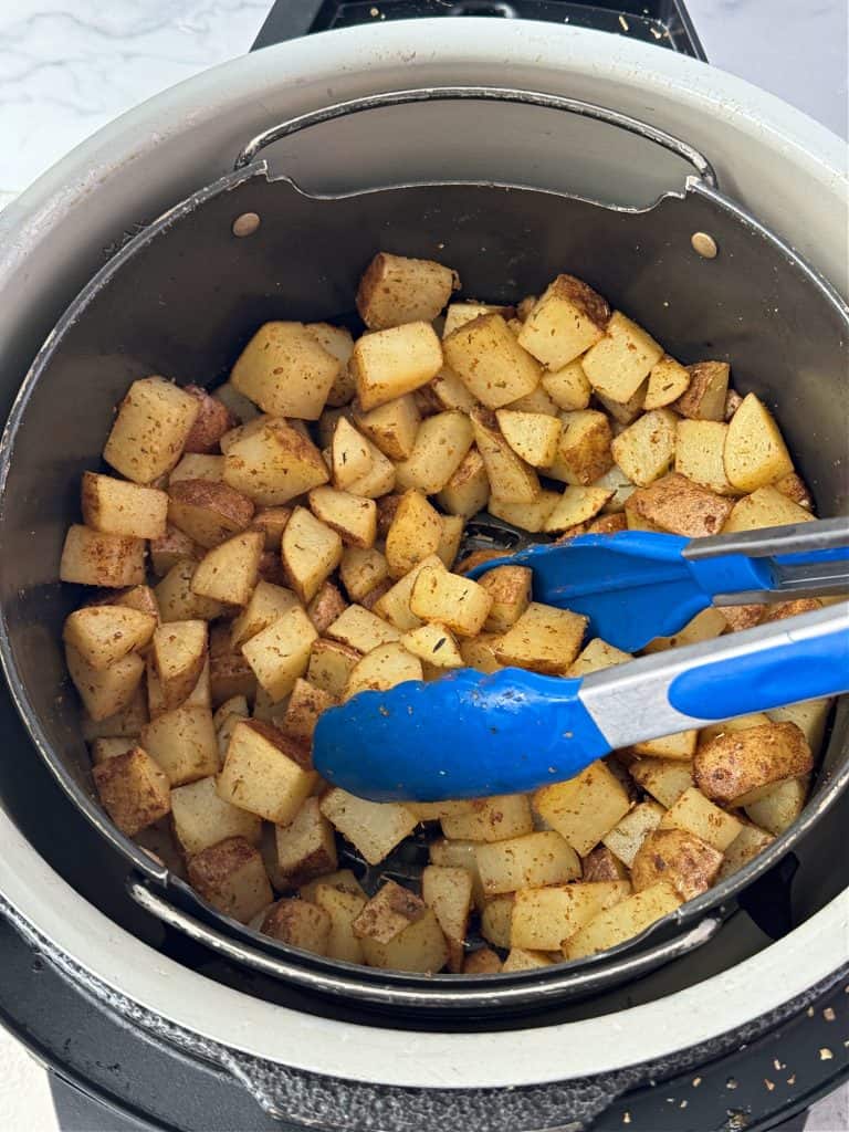 toss potatoes at halfway mark during air frying 