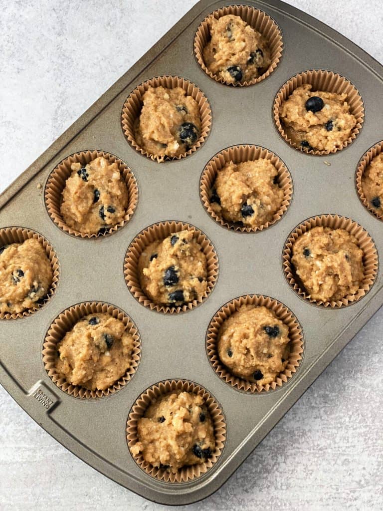 scoop muffin batter into pan