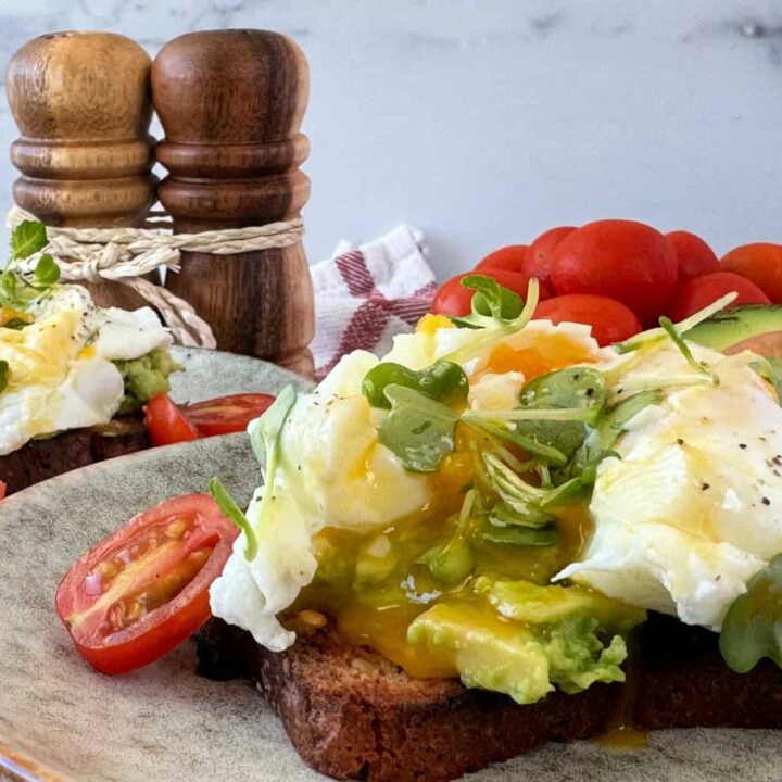 Poached Eggs Recipe on Avocado Toast with Tomatoes