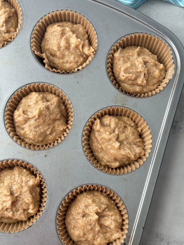 healthy banana muffin recipe batter in muffin cups 