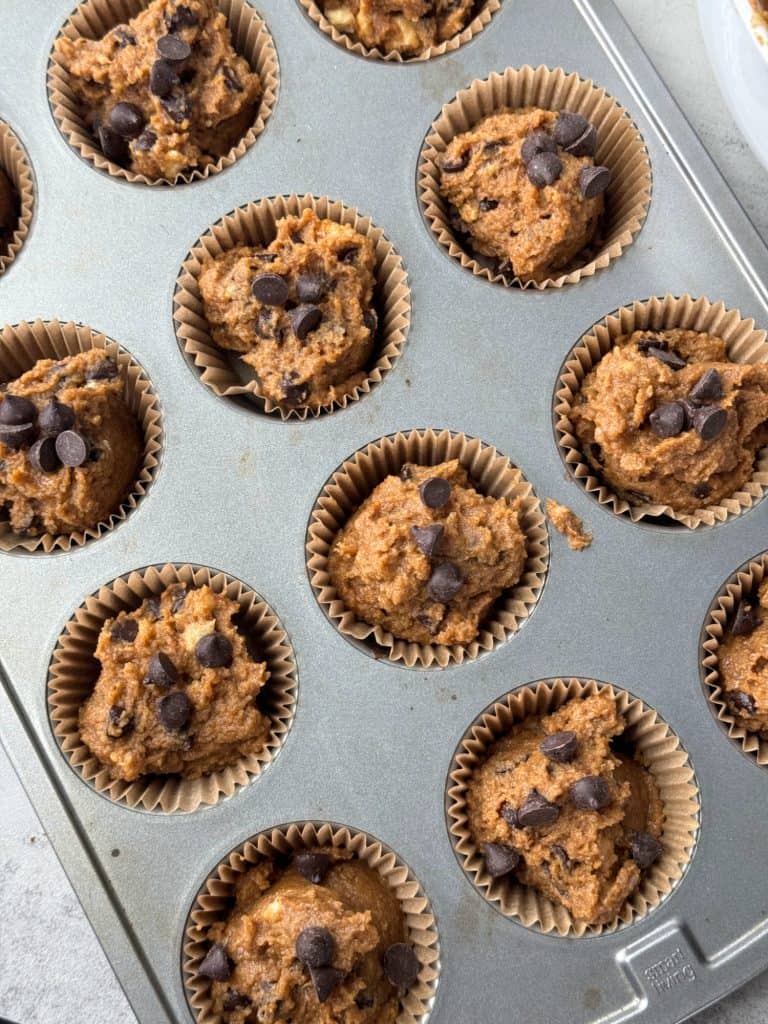 muffin batter in muffin tin