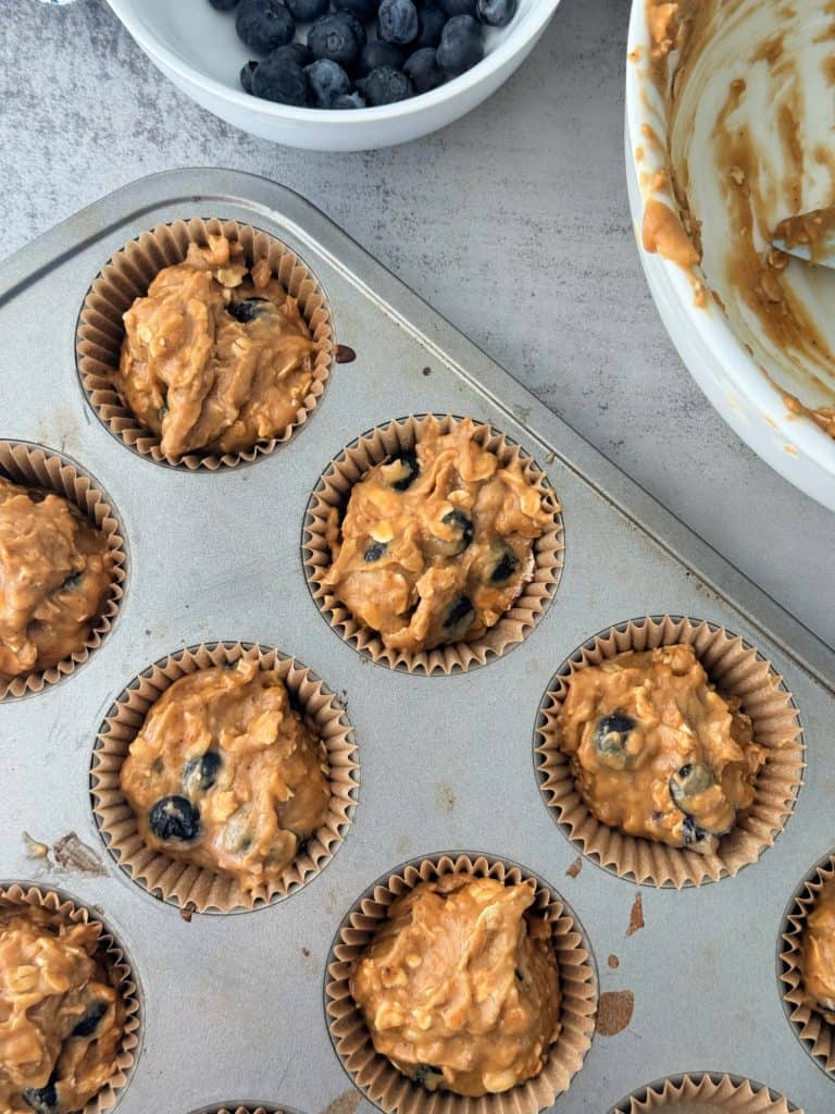 muffin batter in muffin tin