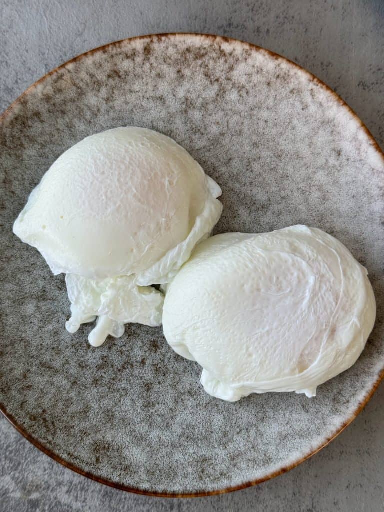soft poached eggs on a plate 