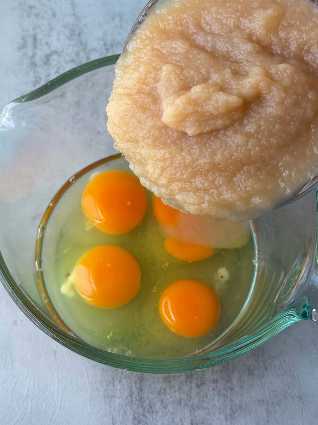 eggs in a glass bowl with applesauce