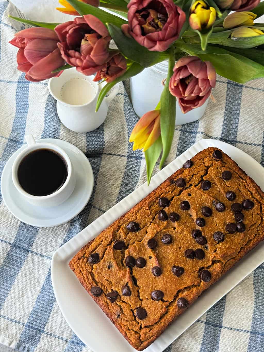 easy healthy almond flour pumpkin bread recipe with applesauce on white platter
