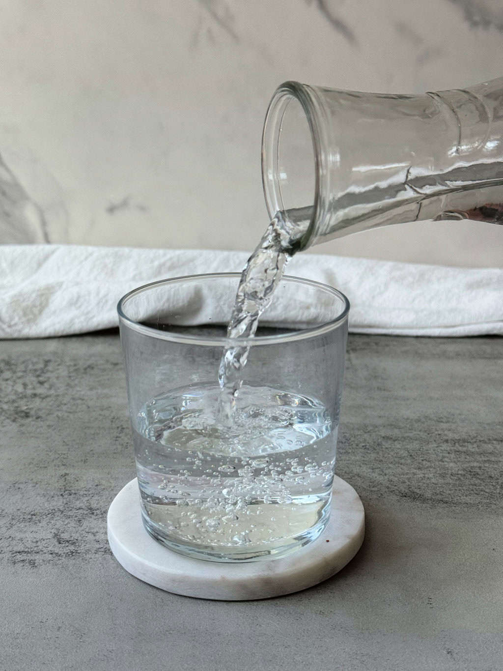 pour water into a glass