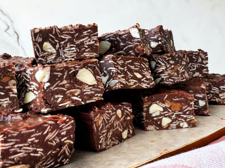 No Bake Chocolate Oatmeal Bars Recipe with Almonds stacked on parchment paper